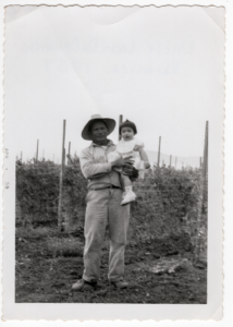 Manong Leon DeOcampo holding his niece, Veronica DeOcampo (b.1958), at the Rosser-Lazo Ranch on San Miguel Canyon Road in Aromas (1959).