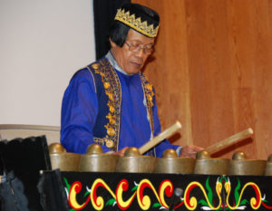 Master artist of Philippine kulintang music, the late Danny Kalanduyan, holds two big sticks as he plays his instrument at ACTA’s first Sounds of California concert at the Oakland Museum in 2015.
