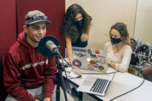 Santa Rosa Junior College Oak Leaf journalists Nick Vides, Rebecca Bell and Lauren Spates sit in a room with a microphone and computer to record their podcast.