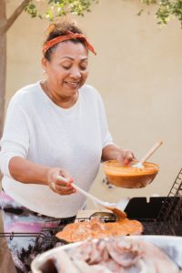 María Elena cooks Pescado a la Talla.