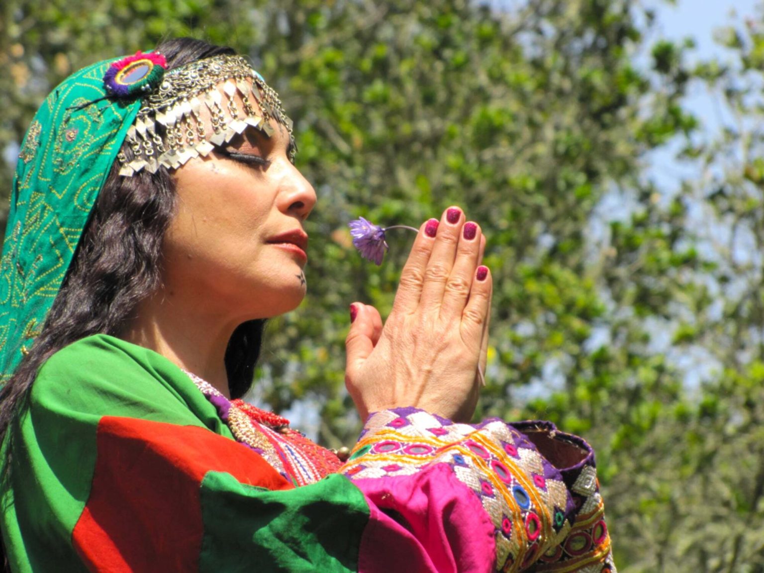photo of woman with headscarves and prayer hands