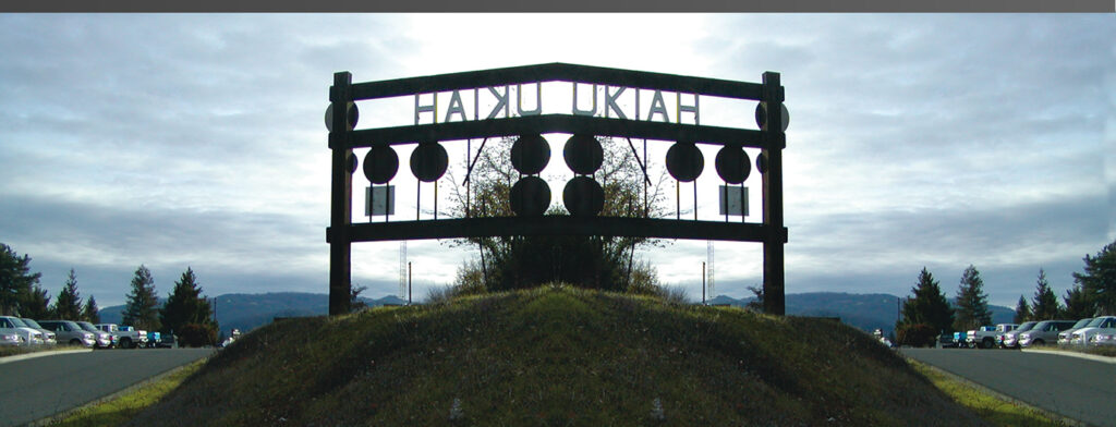 A gate inscribed with UKIAH stands against the horizon.