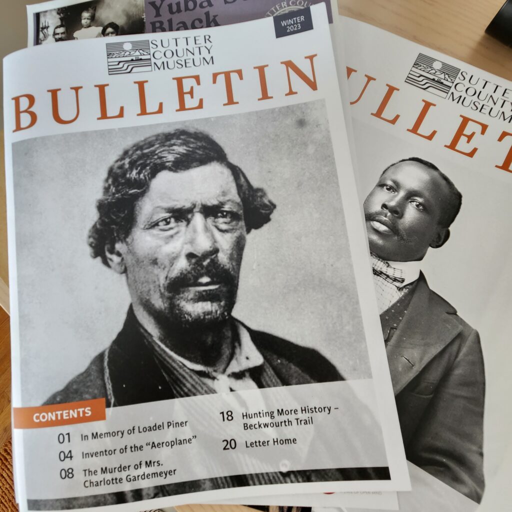 Photograph of two Bulletin covers, featuring black and white historic photos of men