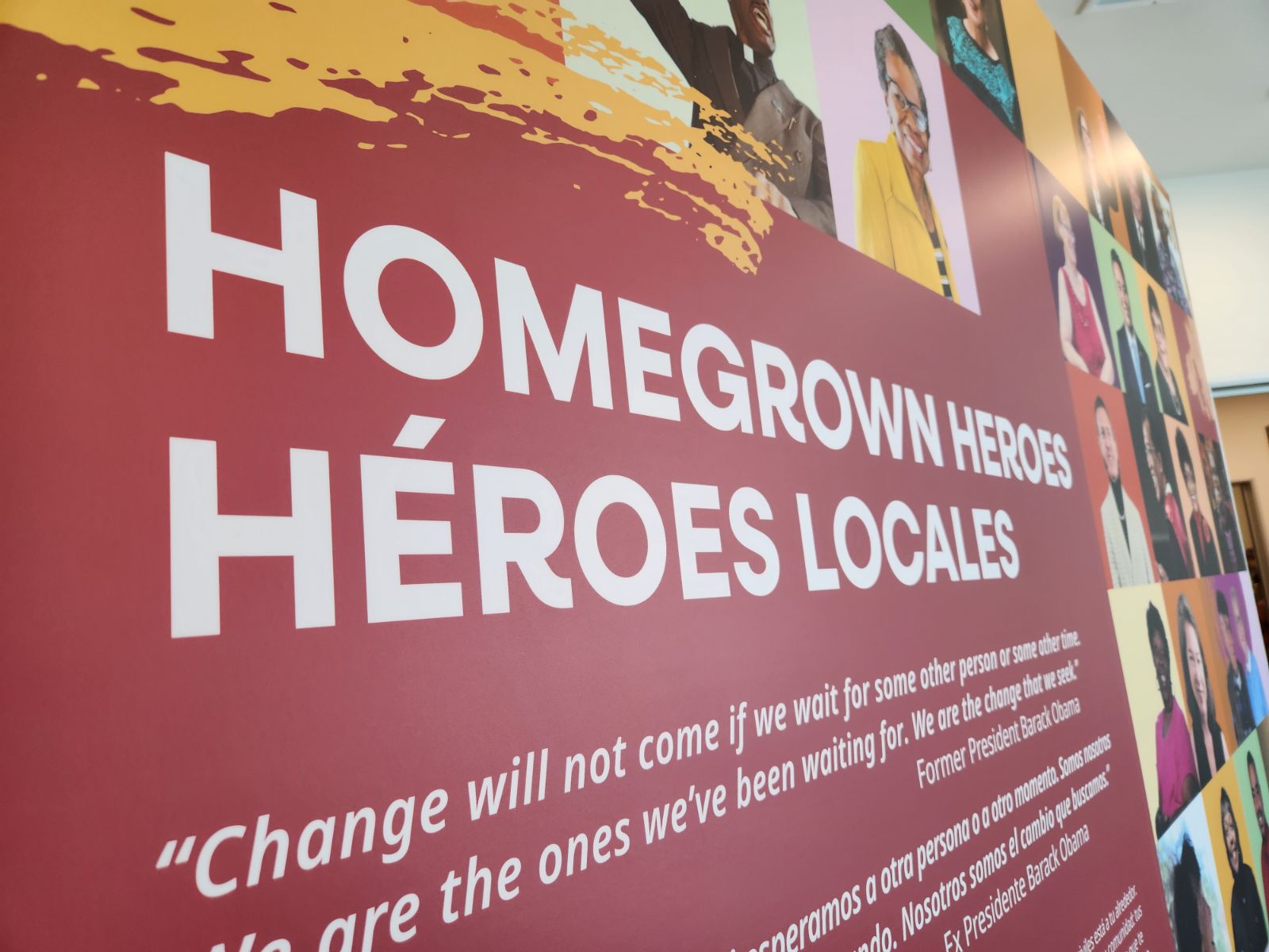 Closeup of an exhibit panel with text in white reading Homegrown Heroes Héroes Locales