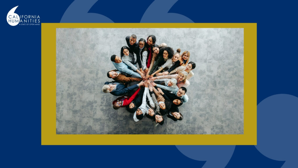 Photo of people in a circle looking up